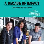 Cover of the 2021 impact report. Three people stand at a table. One is smiling at the camera. Two are smiling but looking down at the table in front of them.